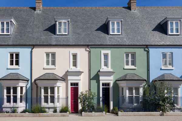 A row of colourful terraced houses, pictured on a sunny day