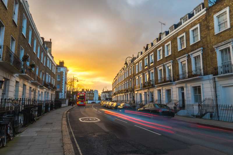 A street of traditional terraced houses in London, UK